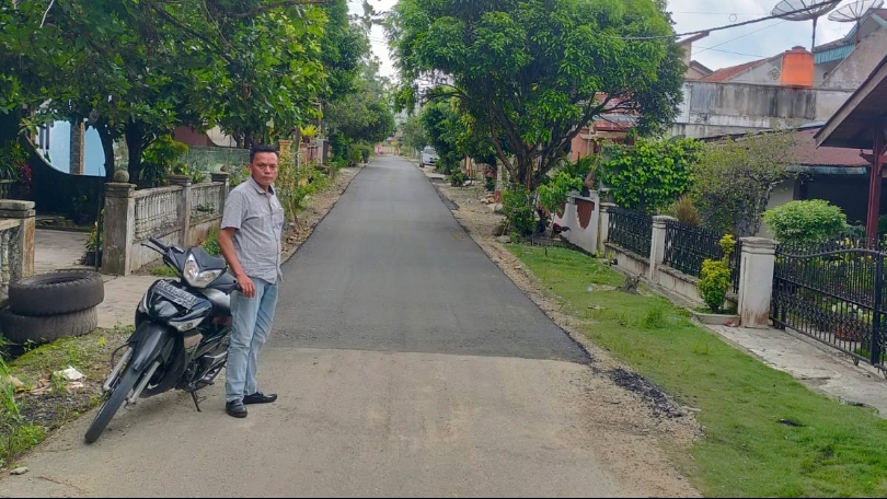 Jalan H Iwan Maksum yang diaspal (portalswara.com/dok)